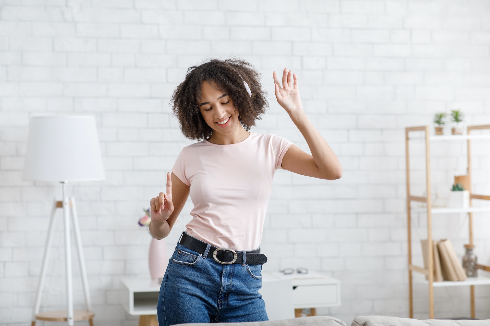 Spare time, home alone and hobby. Happy young african american dancing